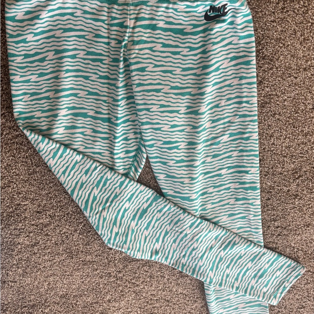 Nike Aqua and White Wave Leggings.    56% cotton 33% polyester 11% spandex
